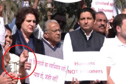 Opposition protest in Parliament wearing handcuffs