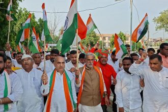 Union Minister of State Krishan Pal Gurjar riding a bike during the Tiranga Yatra in Ballabhgarh Assembly