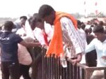 A man with a gun arrived at actor Vijay's rally; women jumped over barricades and entered.